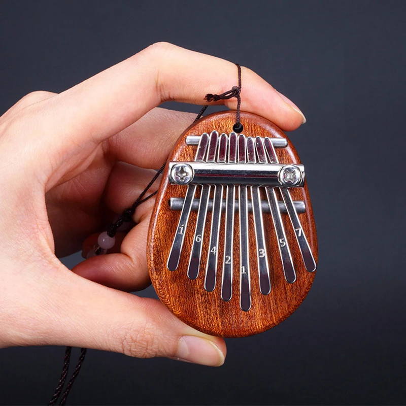 Mini Kalimba portátil para principiantes, Piano de pulgar de 8 teclas, juego de regalo exquisito, mini instrumentos, 1 unidad