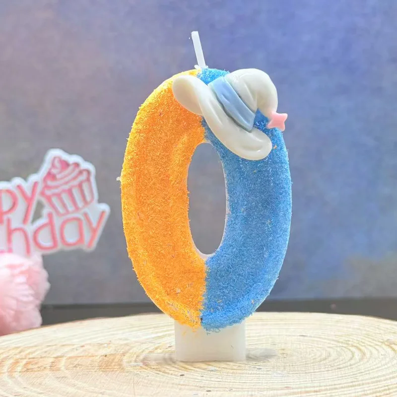 Blue and orange hats decorate candles, as well as small gifts for holiday parties, birthday and anniversary candles
