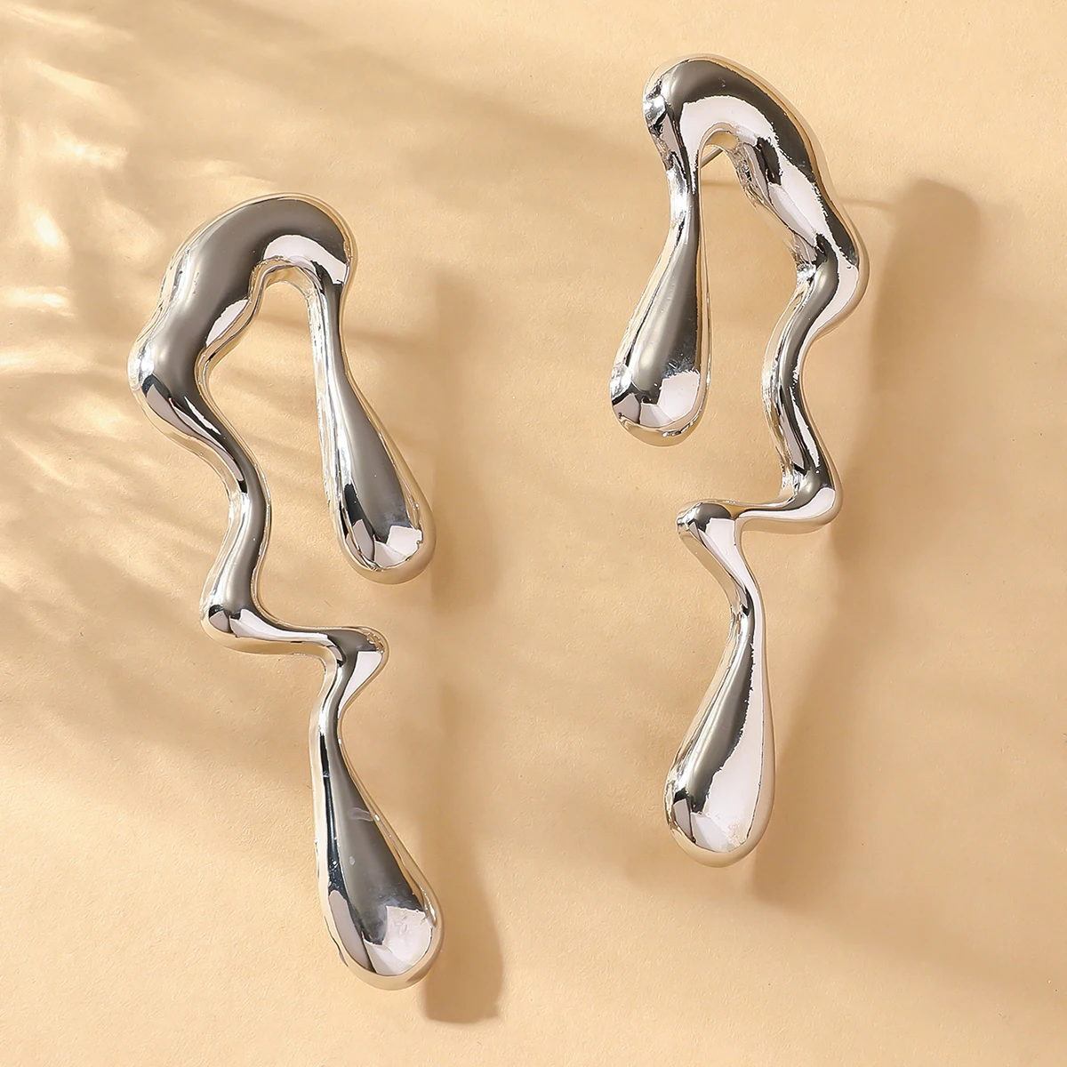 Fashionable women's liquid metal irregular geometric hollow earrings are suitable for dates, parties, holidays, and gifts image 3