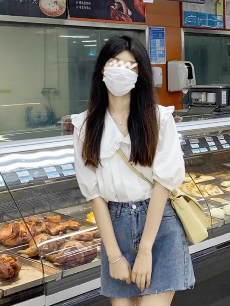 Blanc ort Sve col de poupée irt avec bois ain pour les femmes été Faionable coréen Sle coupe ample bouton détail