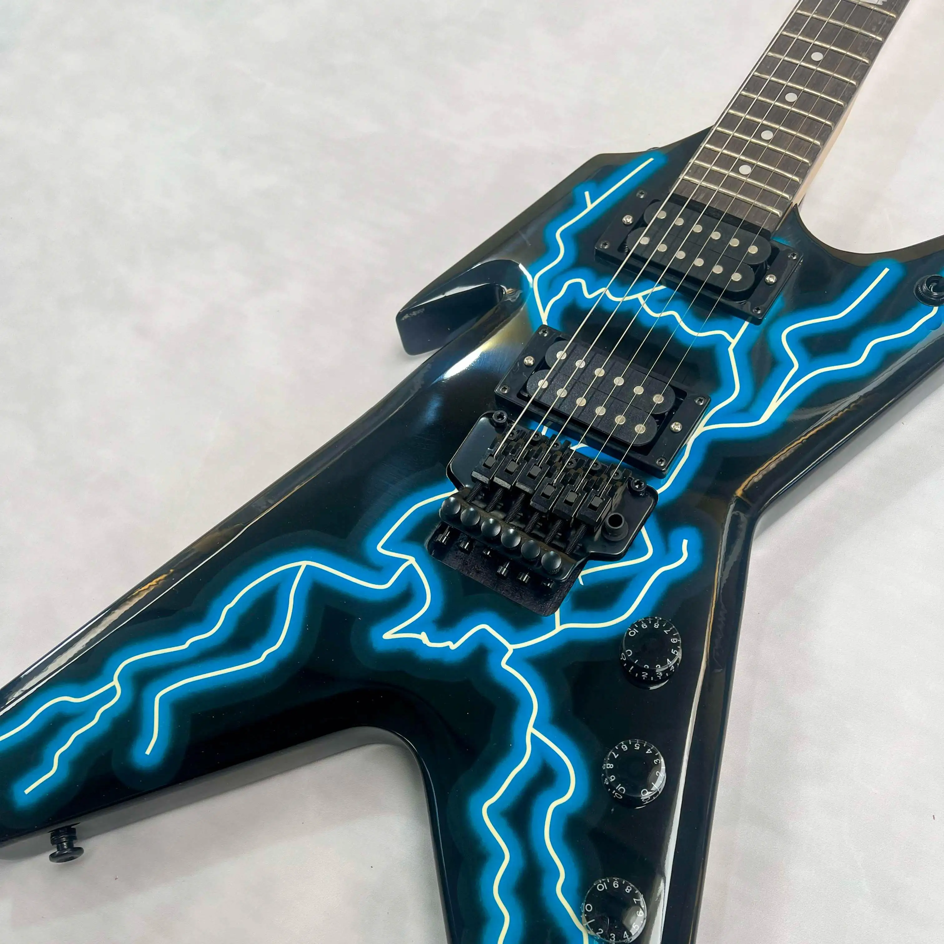 

Blue Lightning Electric Guitar with Large Fork Shape HH Humbucker Pickup Tremolo System Mahogany Suitable for Most Guitar Lovers