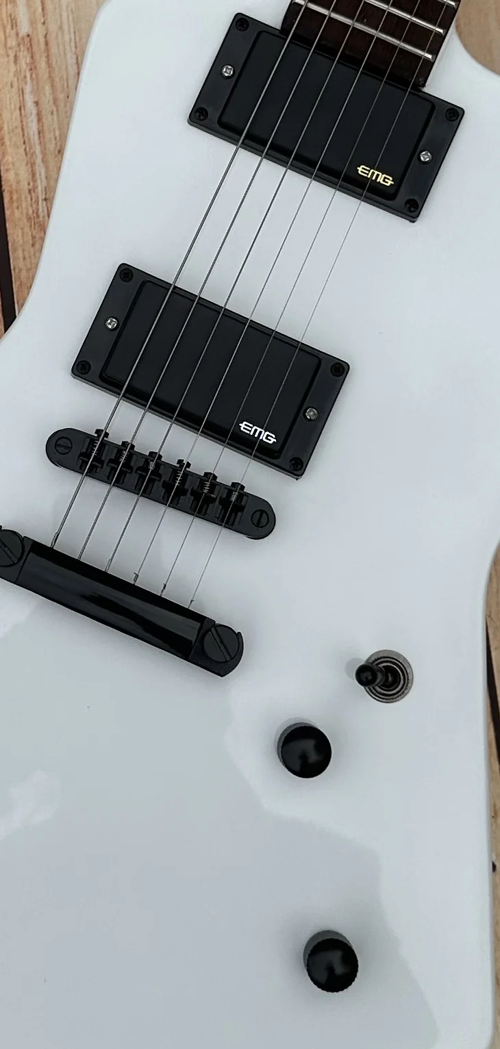 

Irregular electric guitar, made of imported wood, white pearl inlaid fingerboard, EMG active pickup, white light, in stock, ligh