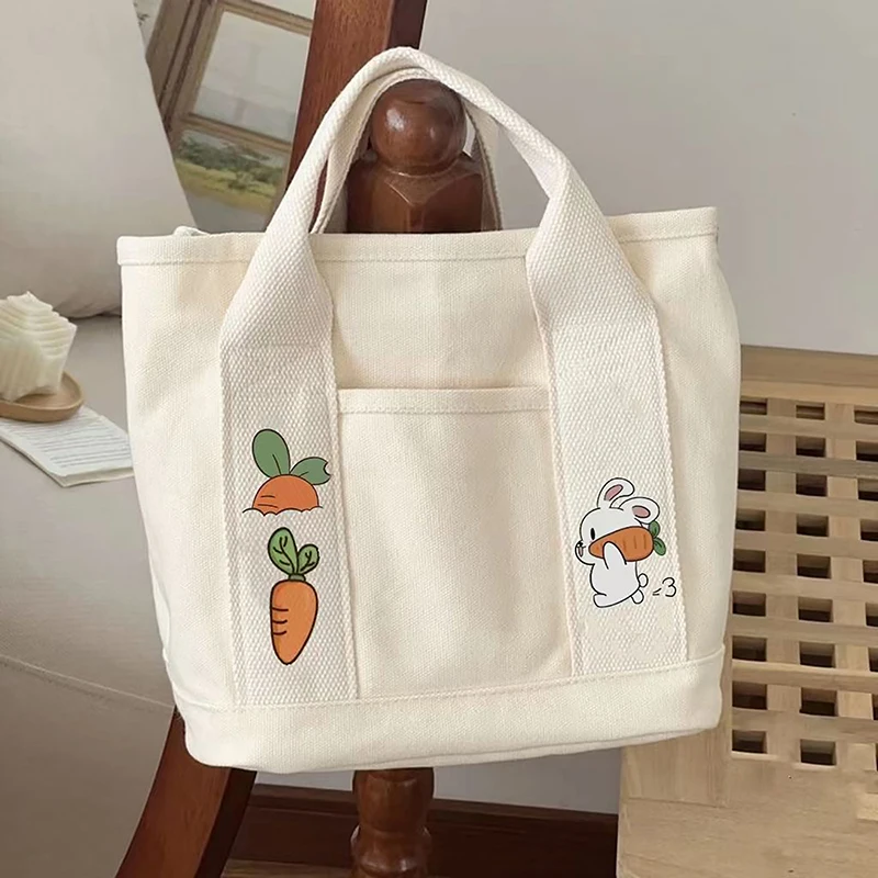 1 bolso de mano de lona con dibujos de conejo y zanahoria para mujer, bolso de mano portátil de gran capacidad con múltiples bolsillos para el almuerzo