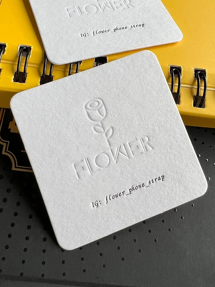 Custom white texutre paper cards emboss relief logo printed 600gsm thickness business cards