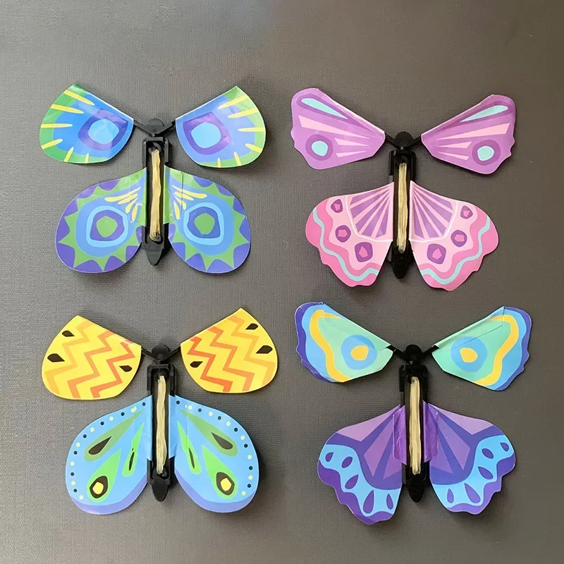 10Pcs Magic Wind Up Flying Butterfly Surprise Box in The Book Rubber Band Powered Toys for Birthday Party Favors Goodie Bag