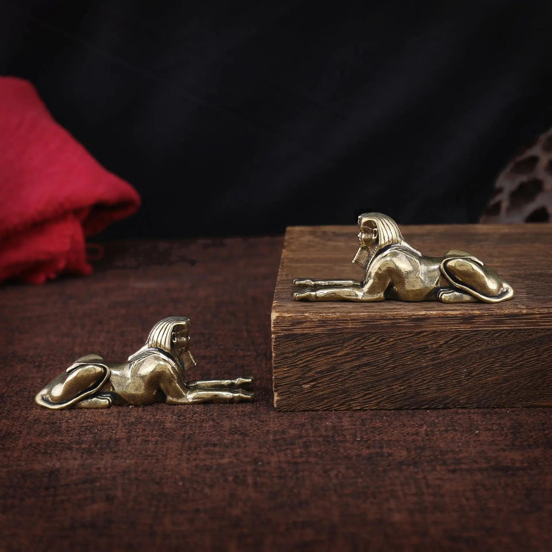 Brass Sphinx figurine miniature landscape tabletop with objects placed on it