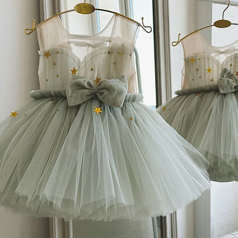 

Light Green Sparkly Star Princess Dress for Girls with Tulle Skirt High-Low Hemline Perfect for Birthday Parties And Weddings