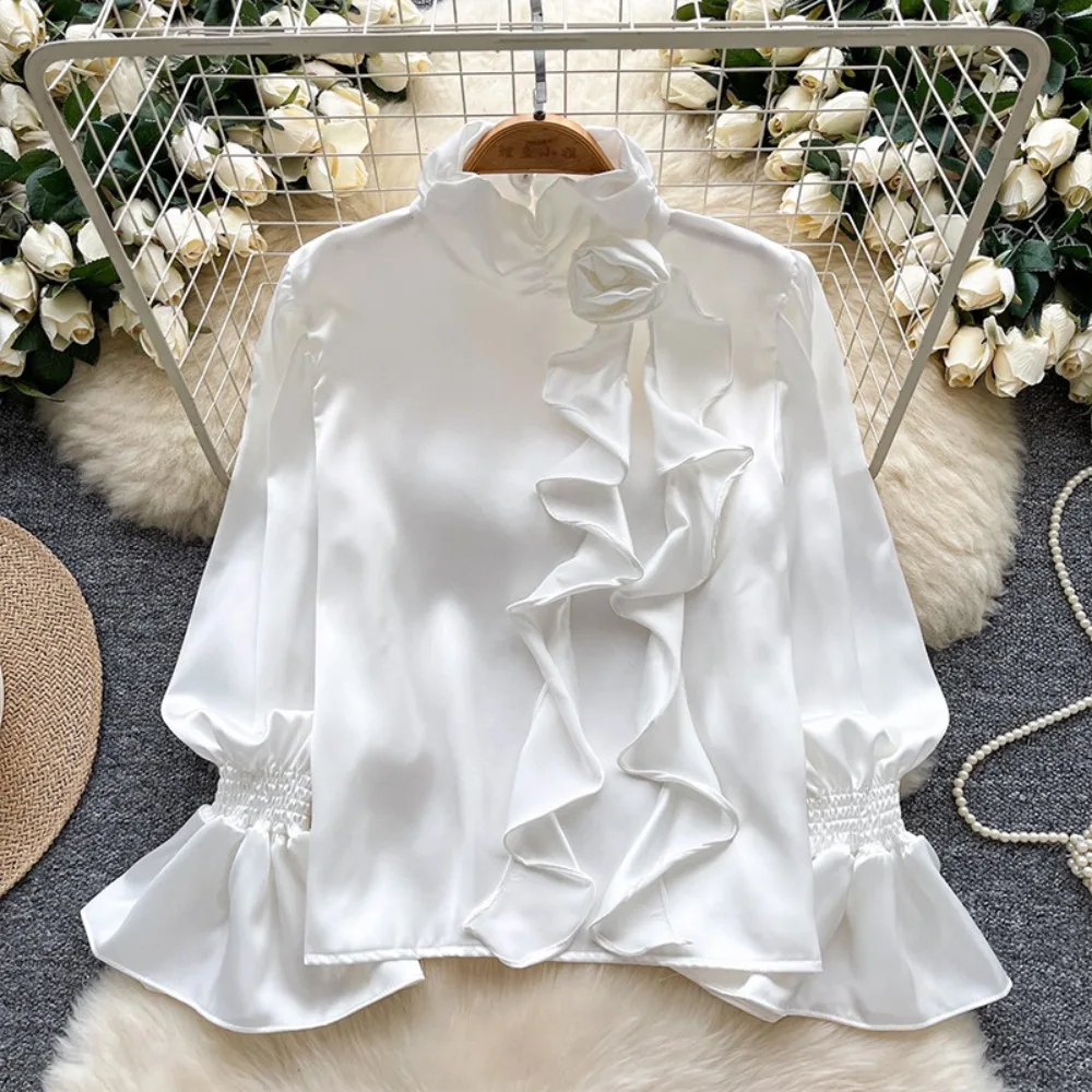 

Women's satin blouse with ruffle details, loose and luxurious top for an elegant style