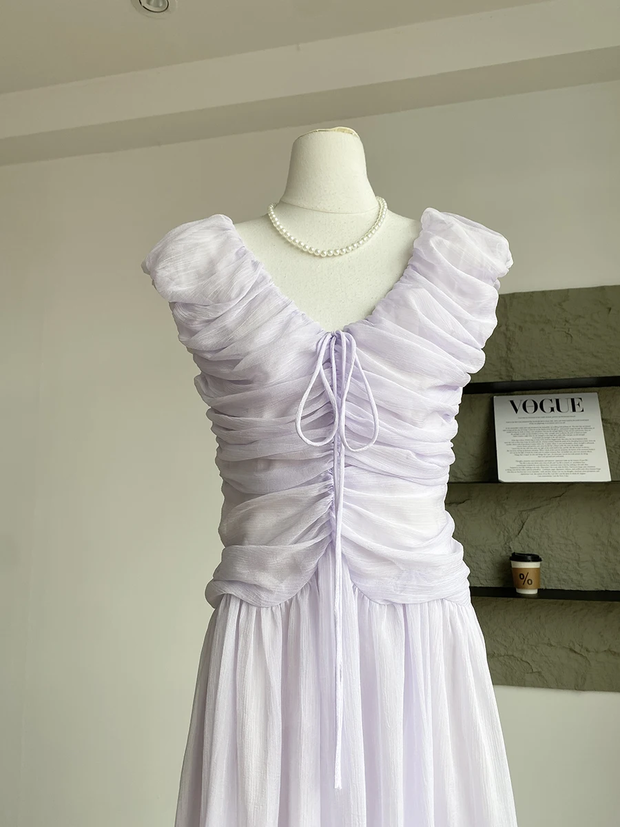 فستان نسائي صيفي أنيق بياقة على شكل V بدون أكمام مكشكش فستان طويل للسيدات بلون سادة وأربطة على شكل حرف A