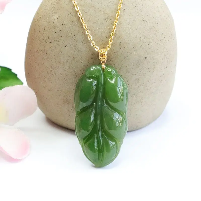 [ ] Xinjiang-grade Hetian 18K gold necklace with a spinach-green jade pendant featuring a leaf design