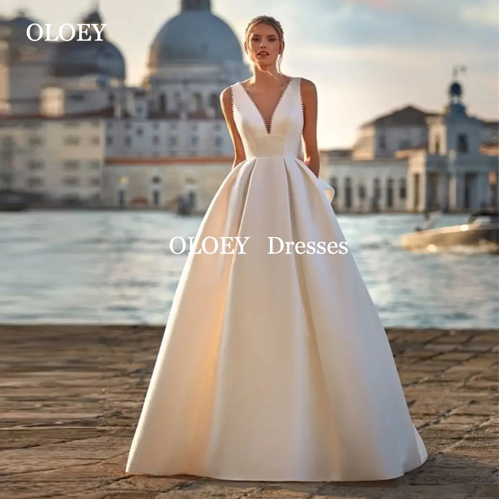 

OLOEY Exquisite Pearls A Line Wedding Dresses Deep V Nck Floor Length Bride Gowns Customized Vestidos De Novia Pleats Bow Back