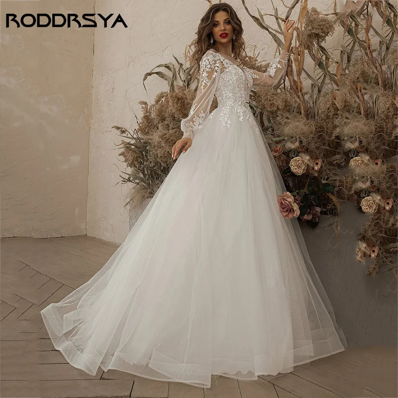 RODDRSYA فساتين زفاف عاجية أكمام طويلة مزين بالدانتيل مغرفة رقبة خط تول-فستان عروس بوهو vestido de noiva BeachRoddrsya عاج عرس ثوب كم طويل Appliques رباط عنق مستدير حرف واحد فقط ثوب الزفاف بوهيميا 2024 شاطئ أسود