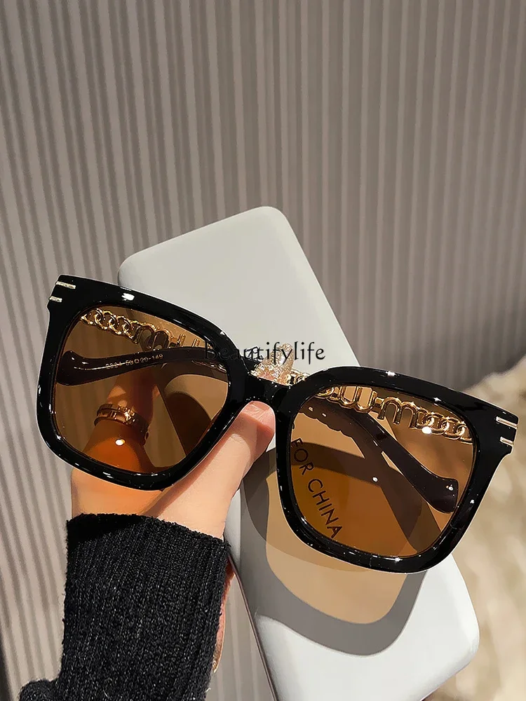 

Personality trendy with transparent brown sunglasses, women's big face shows small face, black fashion chain sunglasses