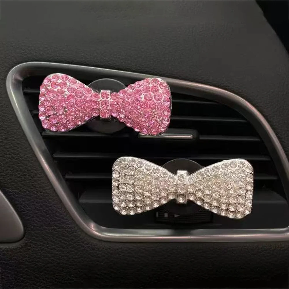

Car air conditioner perfume clip, with fragrance piece, white pink, metal bow, Austrian rhinestone inlay, fresh air in the car