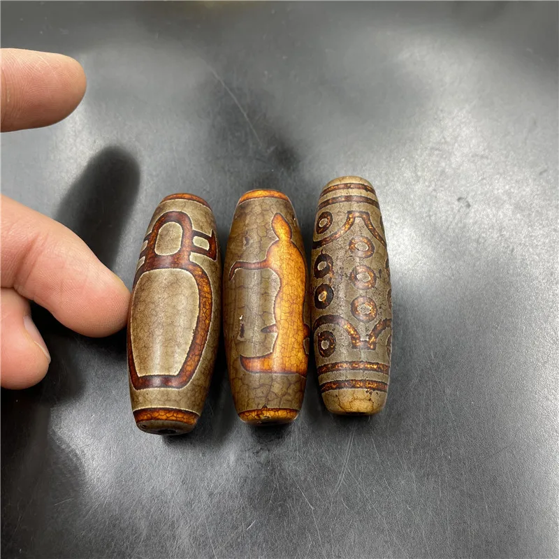 

21 Eyed Agate Dzi Tube Bead Guanyin