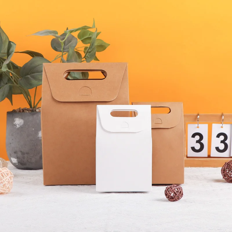 100pcs 10*6*16cm Food Grade Handle Cheap Gift Shopping Kraft Paper Bag Printed Custom Paper Bags Household Products