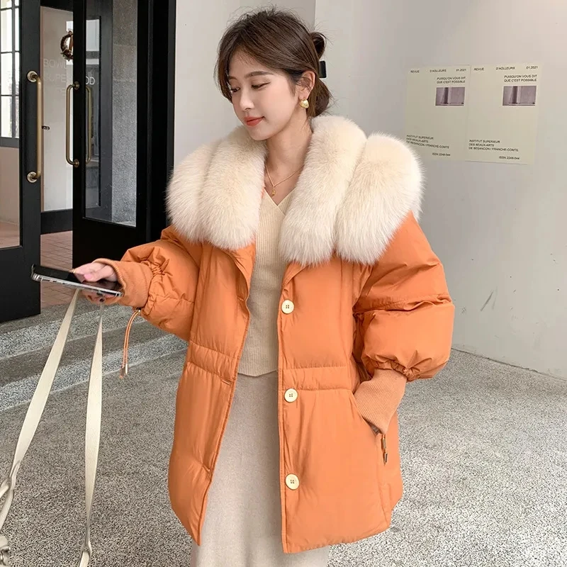 2025 Moda donna elegante pelliccia di volpe artificiale piuma d'anatra bianca nero arancione piumino, cappotti lunghi caldi da donna