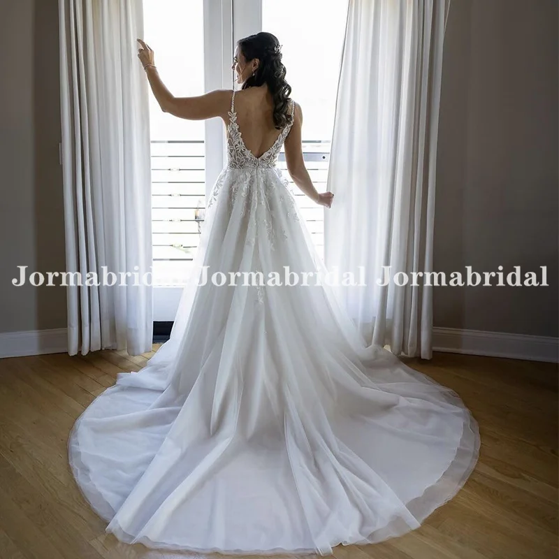 Plunging V-neck White Boho Bridal Gown Spaghetti Straps Appliqués Adorn Illusion Unlined Bodice Soft Tulle Outdoor Wedding Dress