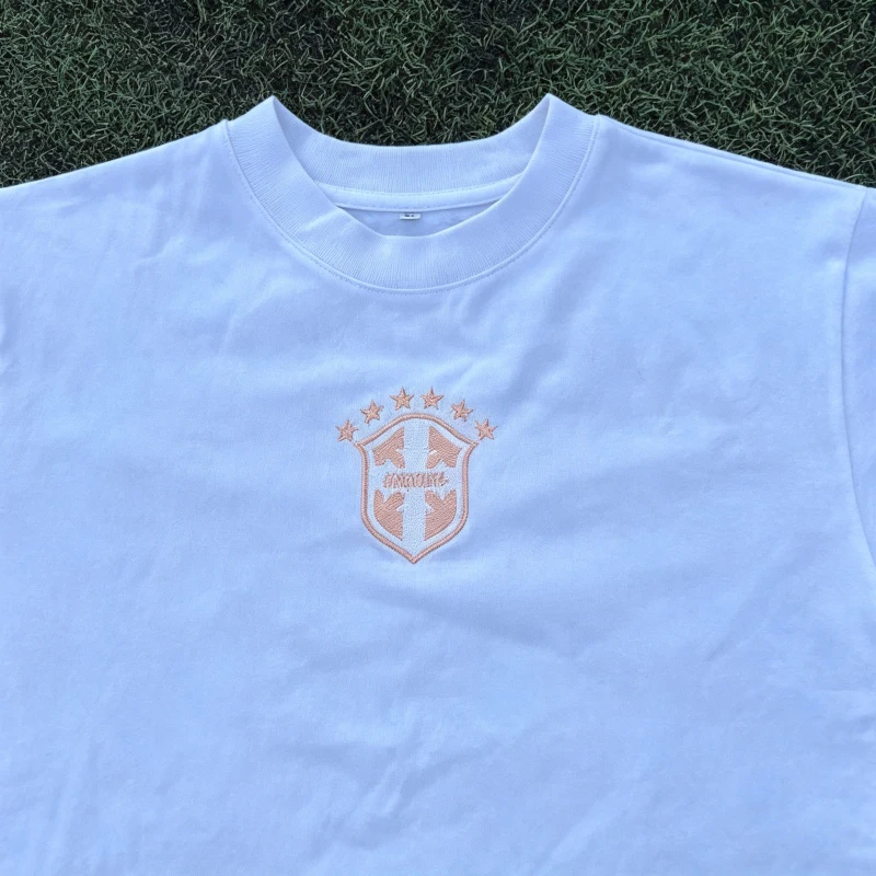 White T-shirt with star emblem embroidered round neck for daily casual wear, unisex top