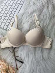 Sexy girl gathered up to support small breasts to show big bra thin bottom thick B cup underwear lady