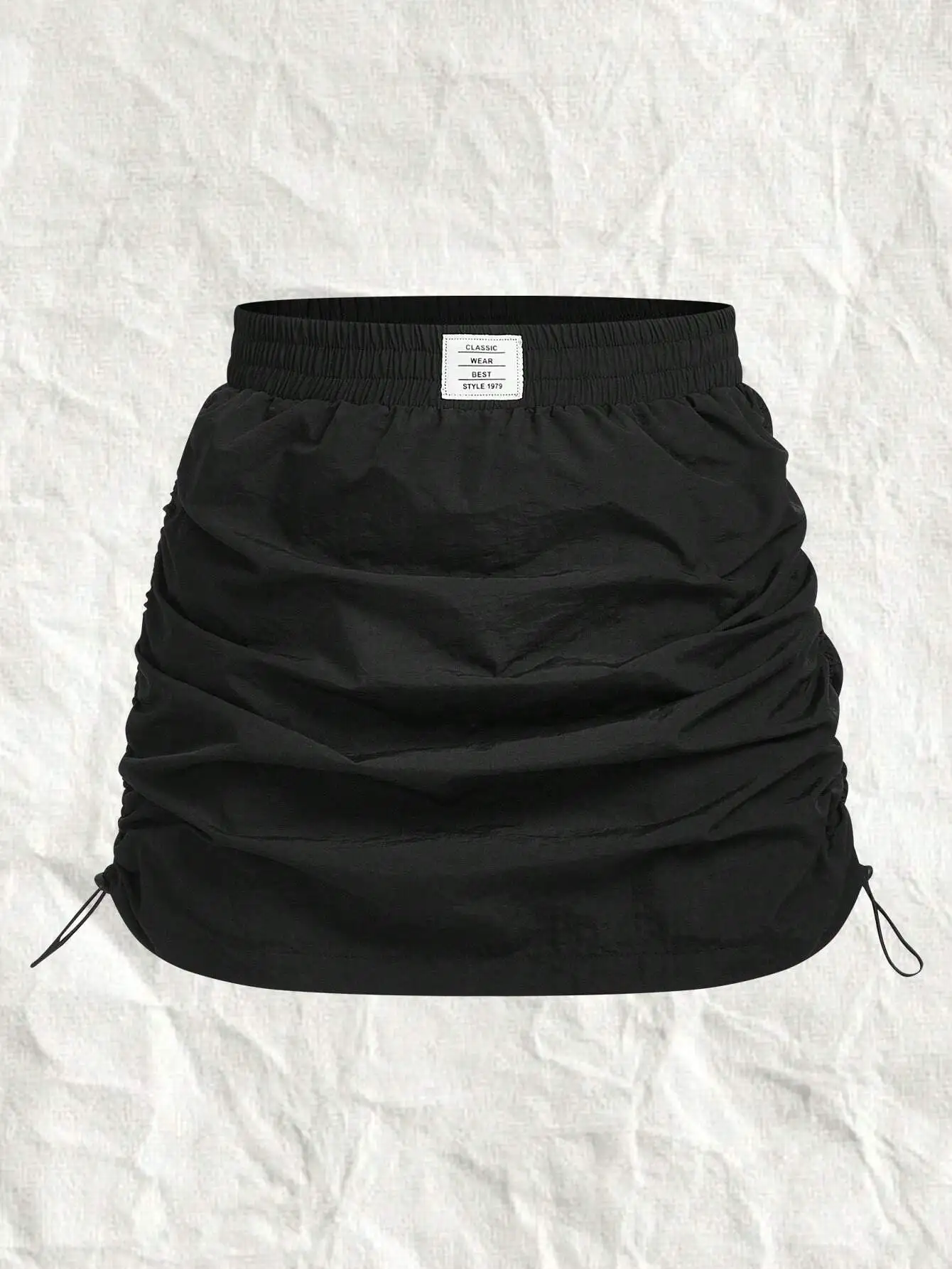 

Черная тканая мини-юбка А-силуэта с драпировкой и эластичной талией