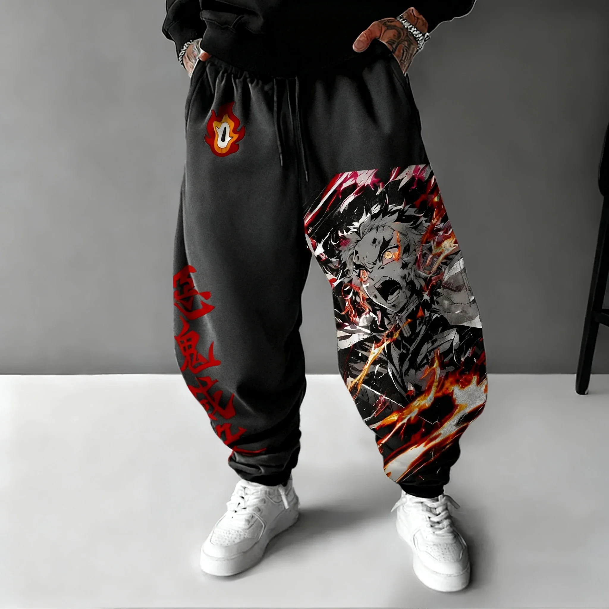 Demon Slayer Anime hombre 2026 Otoño/Invierno pantalones deportivos Rengoku Kyoujurou estampado dibujado a mano deportes Casual moda pantalones ajustados