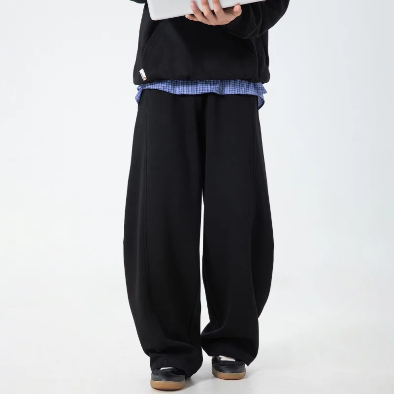 Split splicing textured casual pants for men in autumn new silhouette scimitar trousers drape loose American sports pants