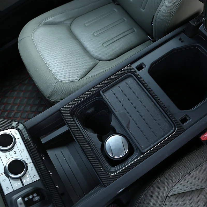 The outer frame of the central storage compartment is suitable For Land Rover Defender 20-23 ABS 1-piece set of automotive parts