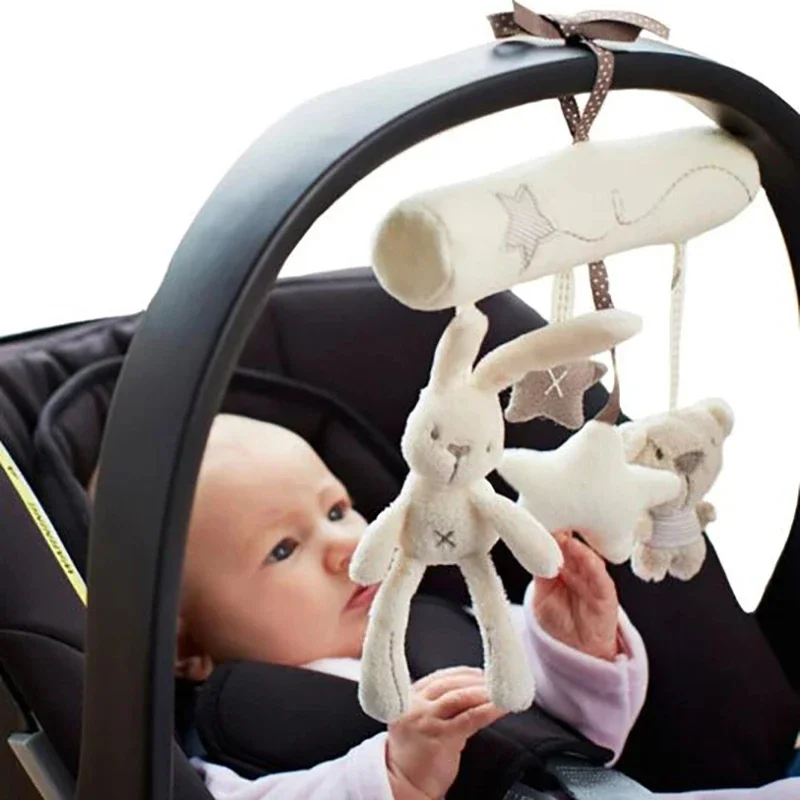 Giocattolo per bambini Letto sospeso Campana a mano di coniglio con seggiolino musicale Peluche multifunzionale Passeggino Regali mobili Giocattolo da appendere per auto