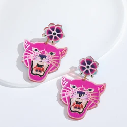 A pair of vintage style tattoo retro gold punk rock leopard cat predator laser cut acrylic earrings