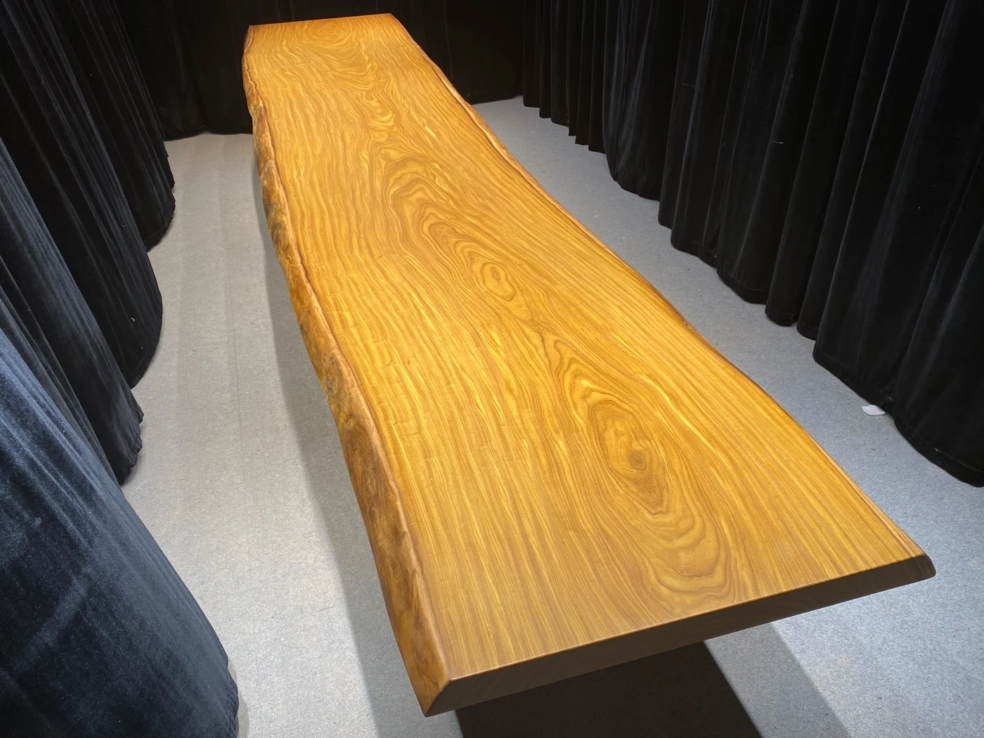 Exclusive Design for Opulent Statement Tables Luxury African Teak Slab with Recurved Live Edge