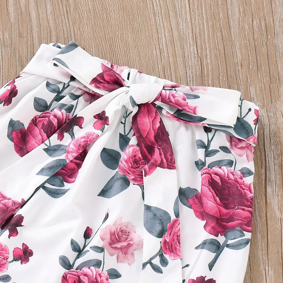 PatPat 3pcs Baby Girl Solid Cotton Ribbed Ruffle Long-sleeve Romper and Floral Print Naia™ Belted Pants & Headband Set