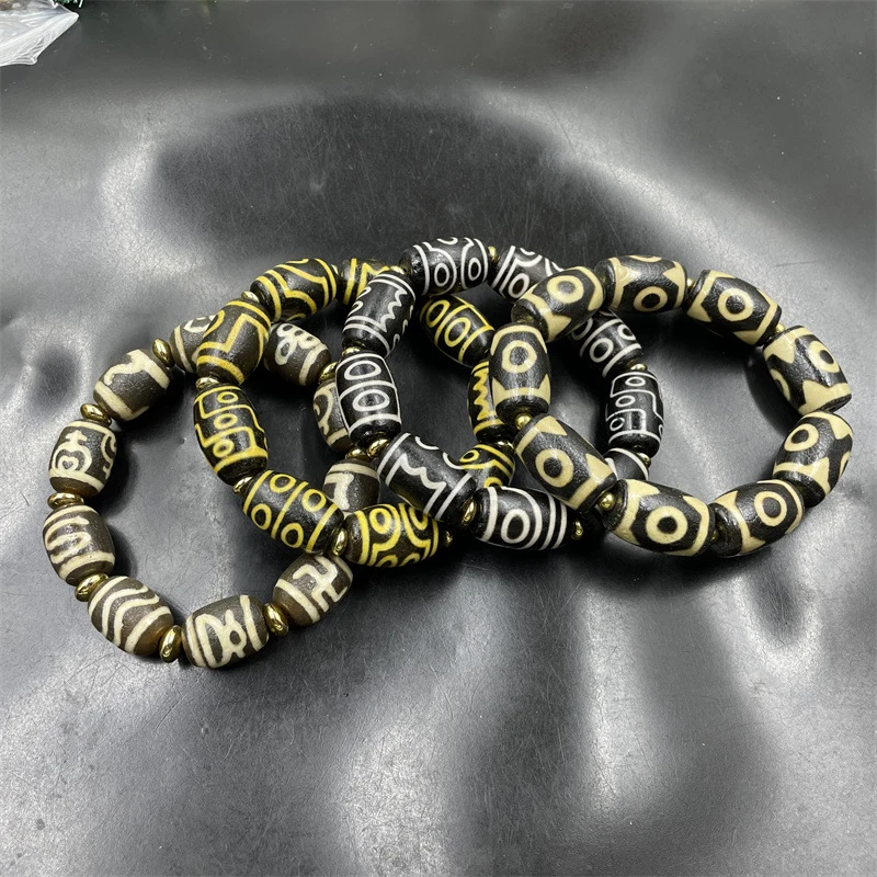 

Винтажный браслет в тибетском стиле из трехсторонних бусин дзи, многослойный, из старого агата, с девятью глазами.