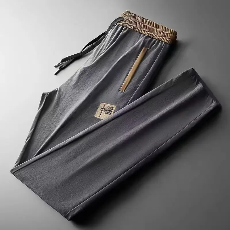 

Wear resistant and dirt resistant work pants, summer ice silk men's pants, construction workers' thin loose pocket zipper pants