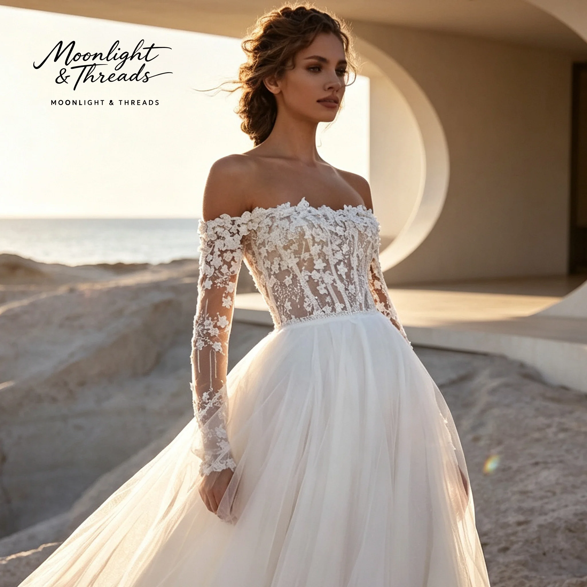 White off-the-shoulder long-sleeved full-skirted formal gown featuring a boned bodice and embroidery perfect for weddings