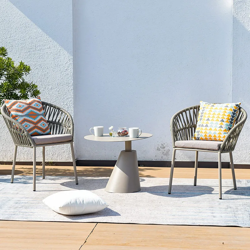 Nordic outdoor rattan dining table and chair combination waterproof sun modern villa courtyard outdoor leisure chair designer