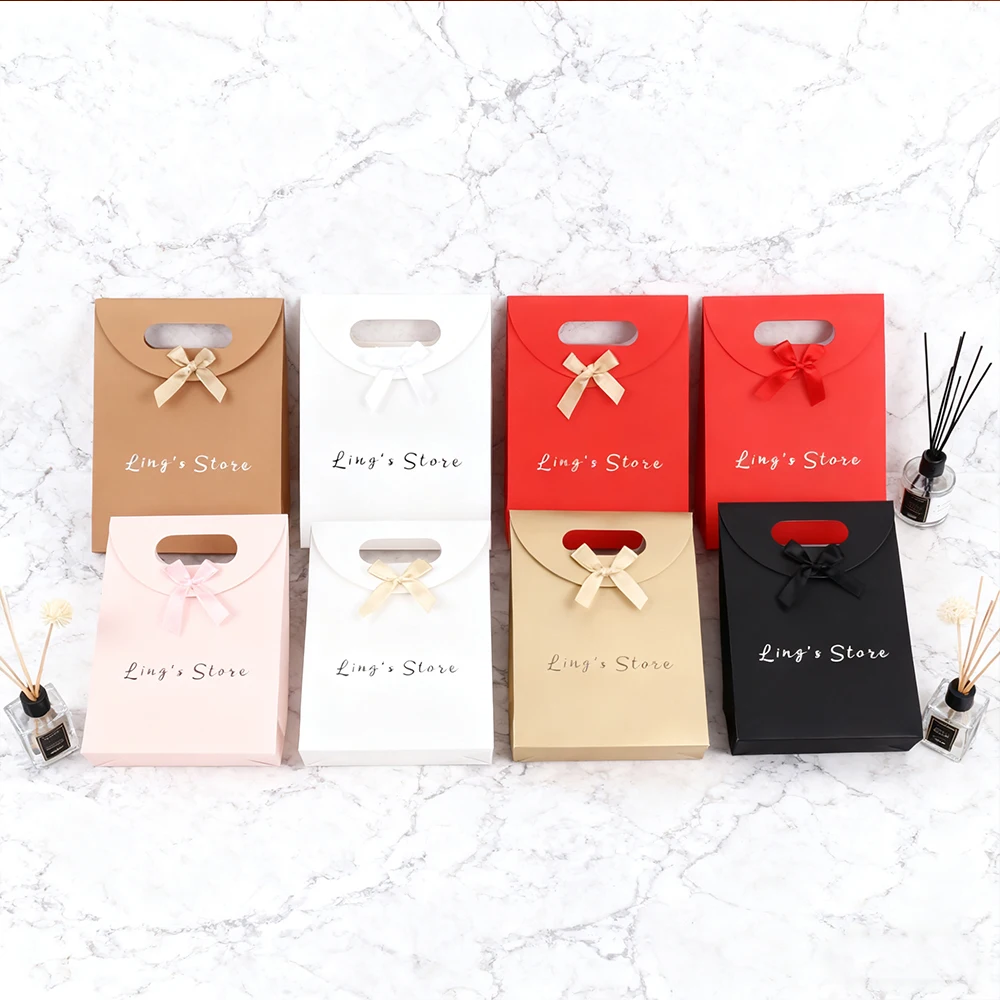 

50Pcs Jewelry Paper Bowknot Jewelry Handle Bag Gift Packaging HandBag Wig Cosmetic Perfume Watch Clothes Organizer Bracelet Sack