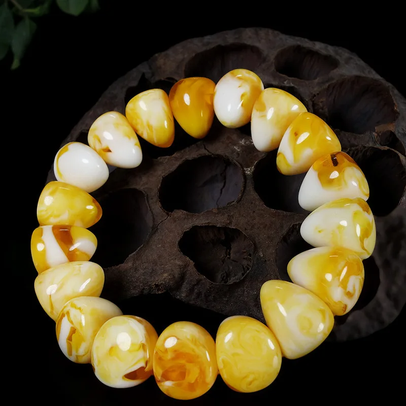 bracelet with honey-colored and white floral amber beads