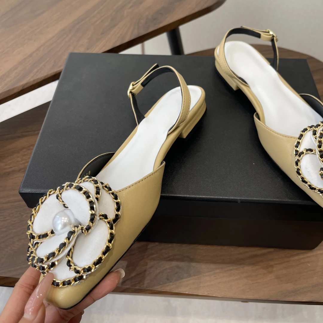 Women's Pearl-Embellished Flats material texture close-up showing full-grain leather grain and pearl surface luster