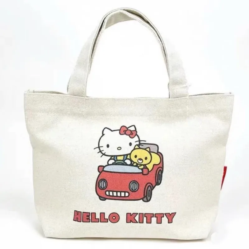 

Hello Kitty Cartoon Canvas Bag Fashionable Airplane Driving Car Large Capacity Cute Tote Handbag Wholesale of Women Accessories
