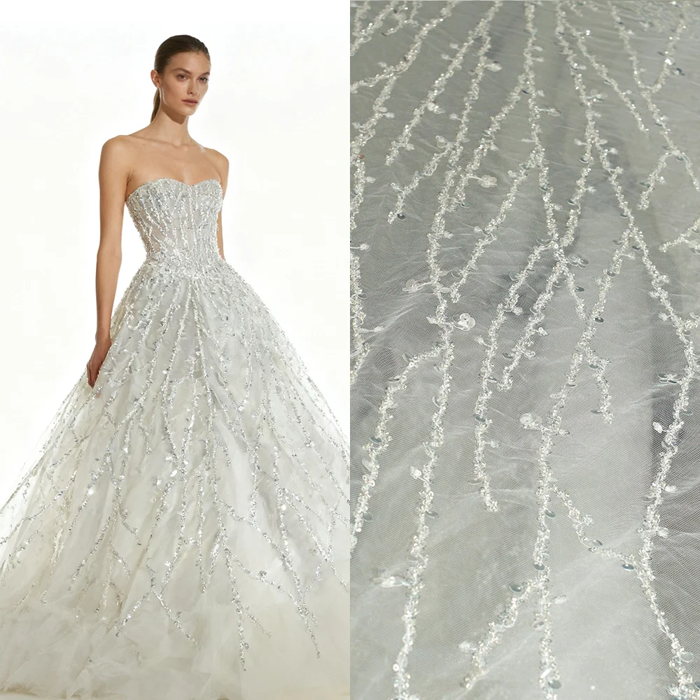 

Lace fabric with exquisite embroidery and a romantic style for wedding gowns and evening dresses