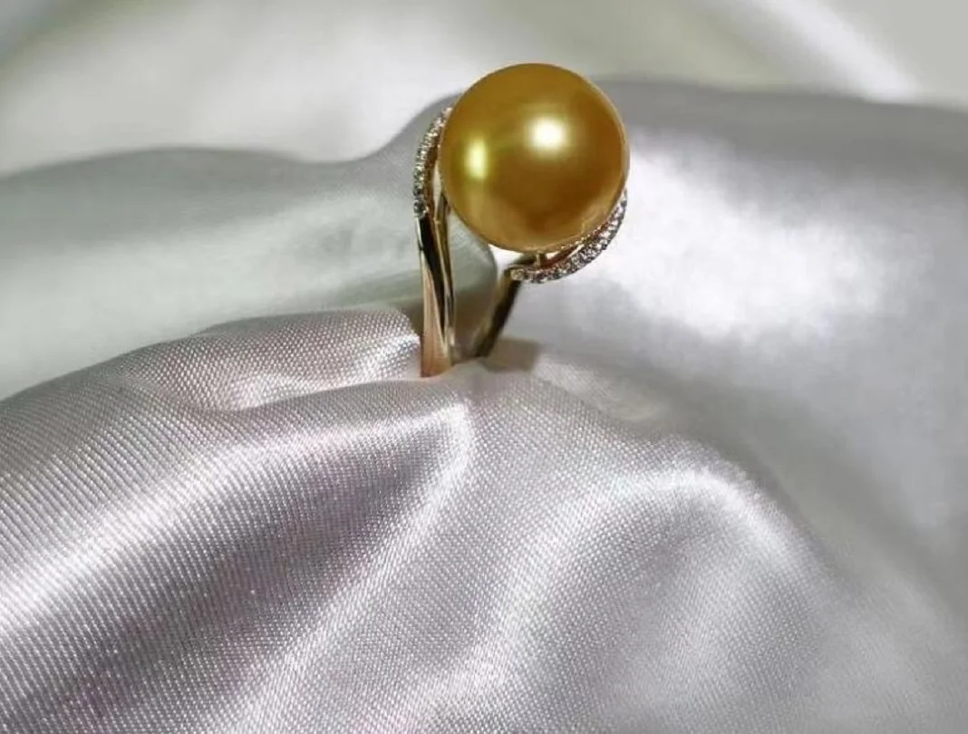 

Beautiful charming 10-11mm natural Nanhai authentic gold perfect round pearl ring.