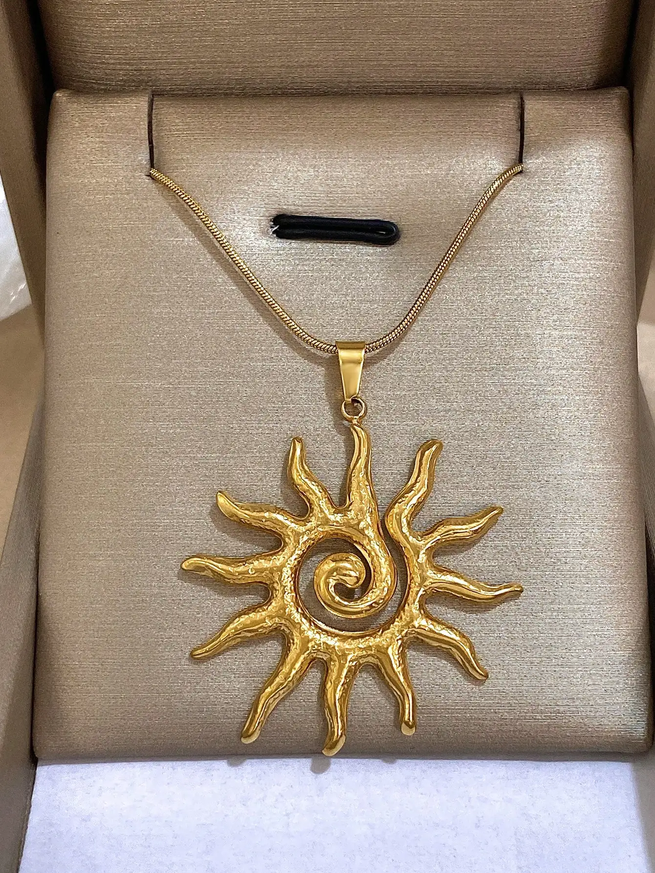 

Gold-Tone Sunburst Pendant Necklace with Textured Spiral Design on Snake Chain