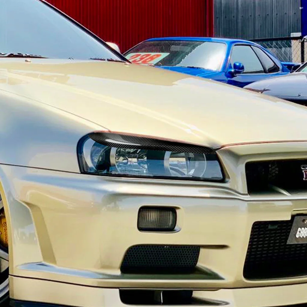 GEFENSI Car Headlights Eyebrow Eyelids Stickers Trim Cover For Nissan Skyline R34 1999 2000 2001 2002 Real Carbon Fiber