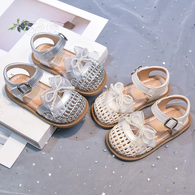 

Детские сандалии для девочек с ремешками и бисерным бантом, новинка 2026 года, летние, плетеные, с мягкой подошвой, для принцесс, для вечеринок и свадеб
