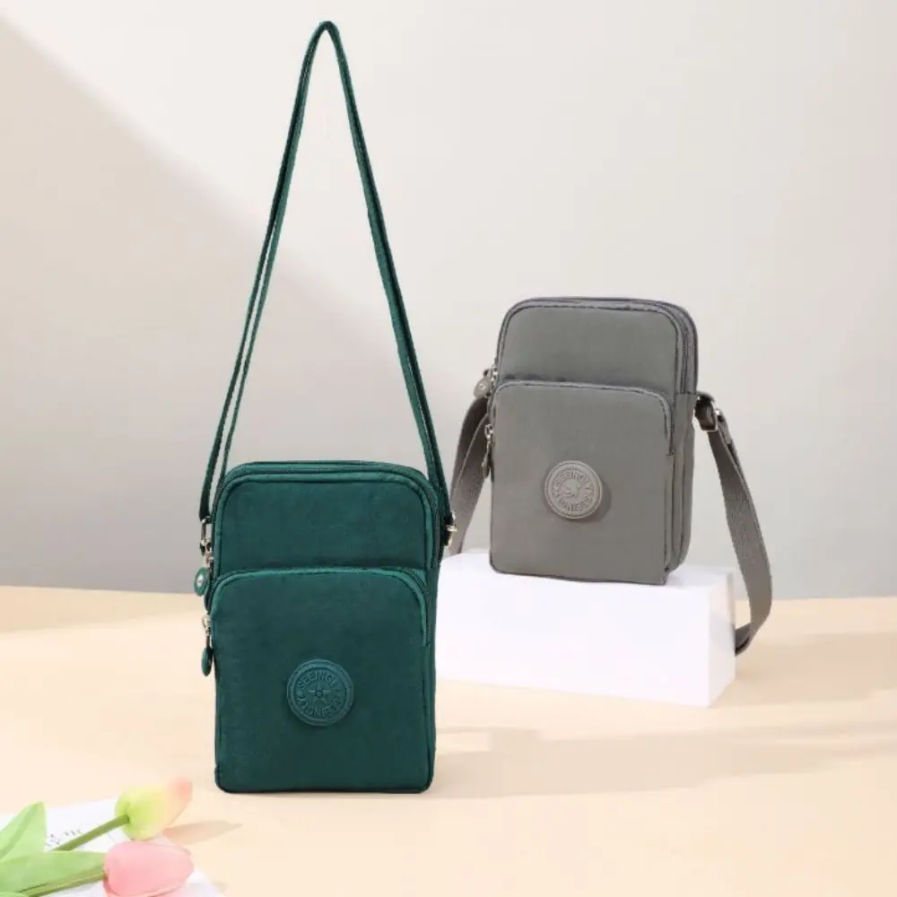 Bolsa de Ombro Casual em Tecido Nylon Impermeável Mini Bolsa Transversal Cor Sólida para Celular e Carteira Feminina