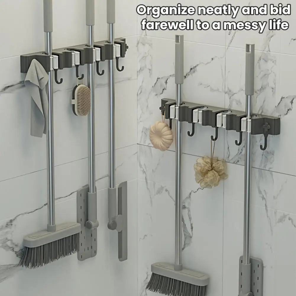 حامل مكنسة ذاتي اللصق يُثبت على الحائط حامل ممسحة لمنظم منزلي سهل مع قدرة تحمل قوية ومناسبة عالمية