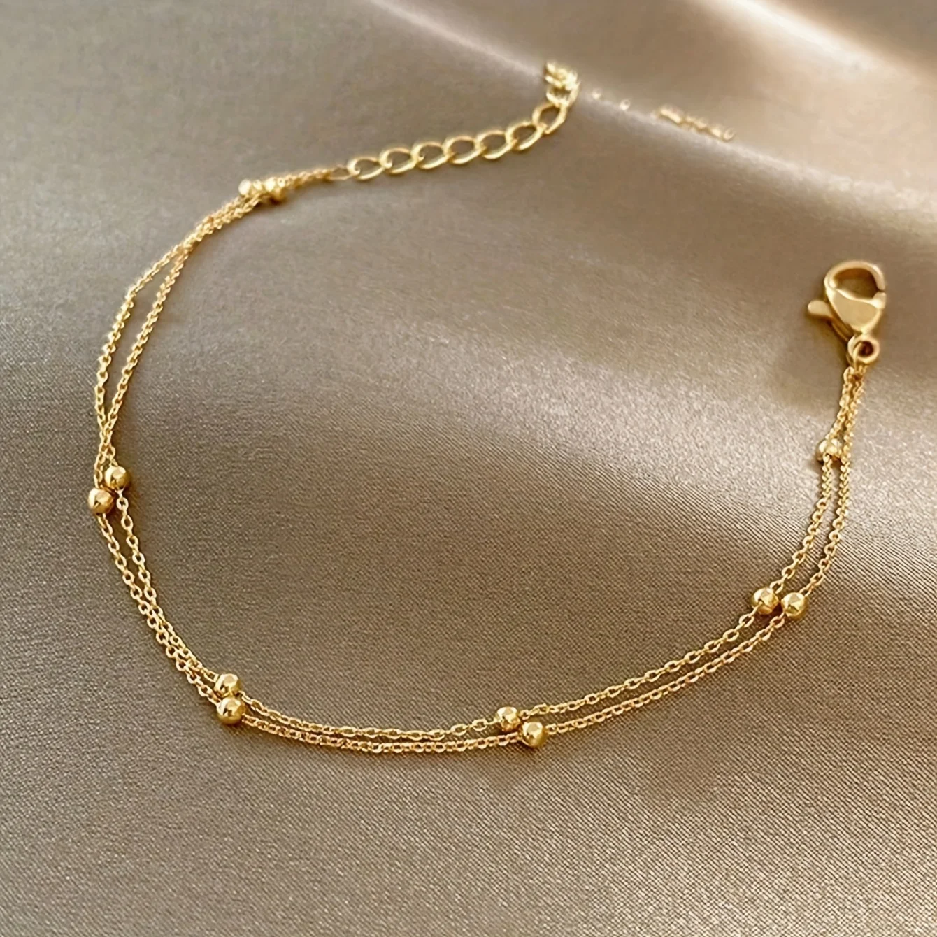 

Multi layer bead chains, anklets, and bracelets, designed specifically for women, blend fashion elements with jewelry craftsmanship, showcasing elegance and delicacy