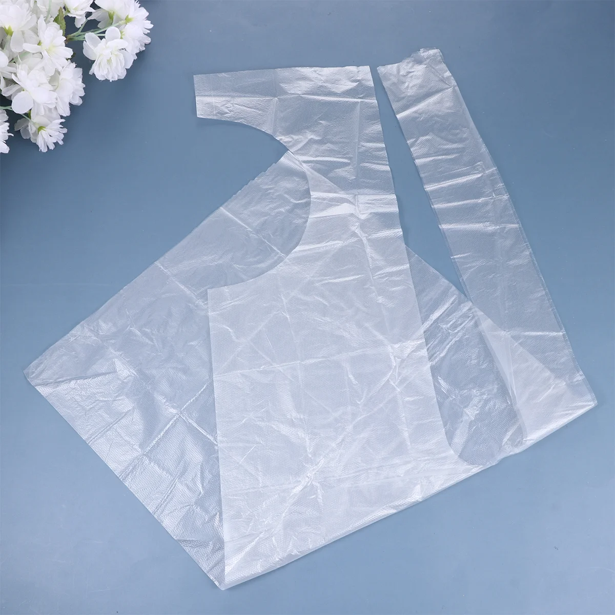 Delantales desechables para niños, delantal de plástico PE impermeable a prueba de aceite para pintar (transparente), 100 Uds.