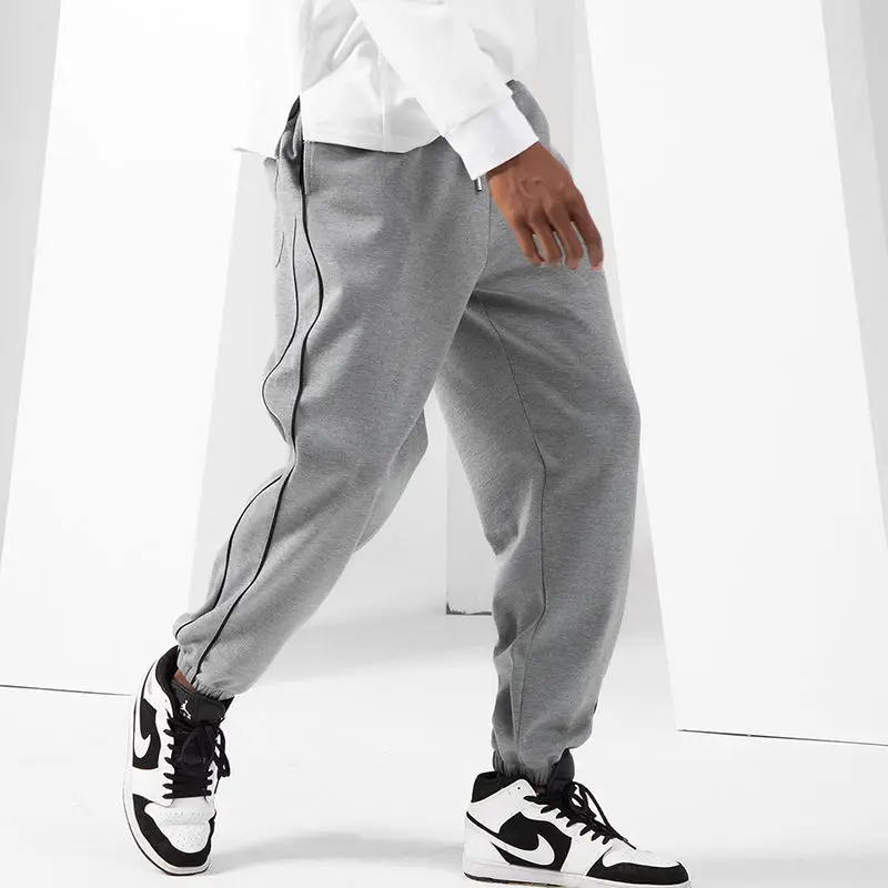 

Korean Trendy Autumn Casual Pants Men Solid Elastic Waist Pocket Drawstring Versatile Sports Harem Bound Feet Sweatpants JJ592